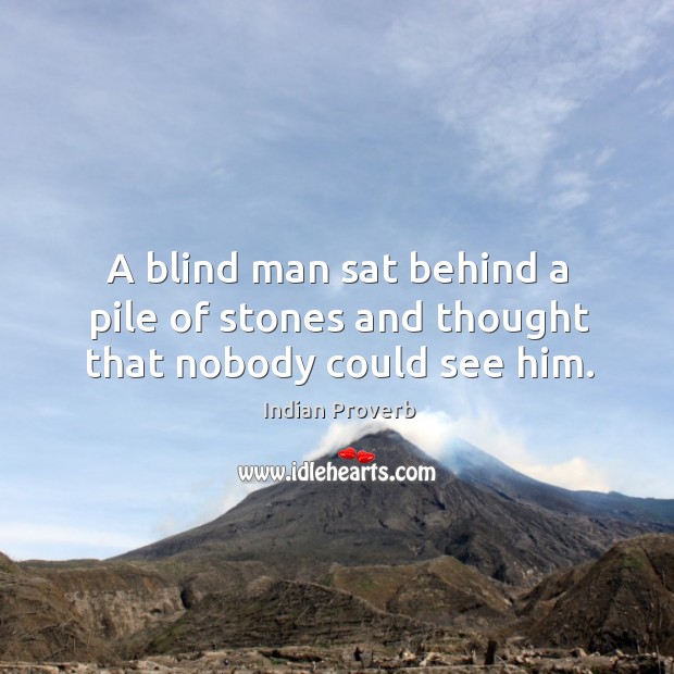 A blind man sat behind a pile of stones and thought that nobody could see him. Image