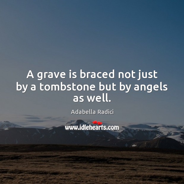 A grave is braced not just by a tombstone but by angels as well. 