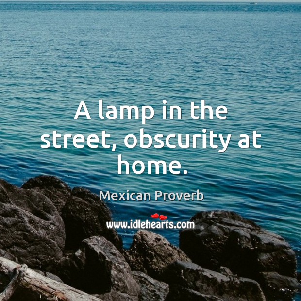 A lamp in the street, obscurity at home. Image