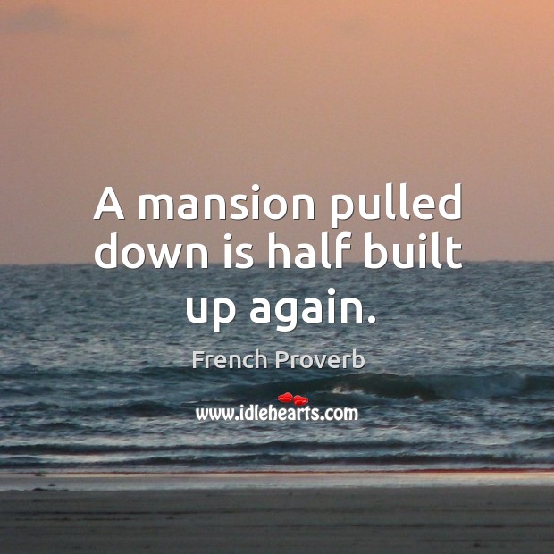 A mansion pulled down is half built up again. Image