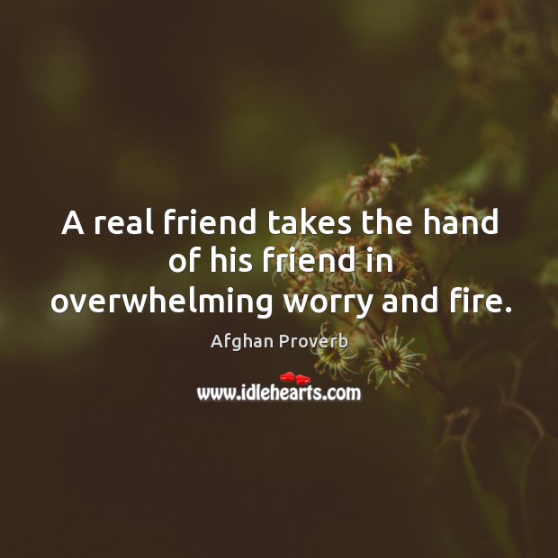 A real friend takes the hand of his friend in overwhelming worry and fire. Image