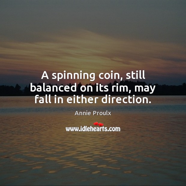 A spinning coin, still balanced on its rim, may fall in either direction. Image