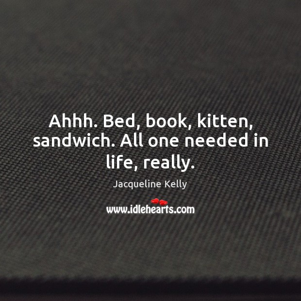 Ahhh. Bed, book, kitten, sandwich. All one needed in life, really. Image