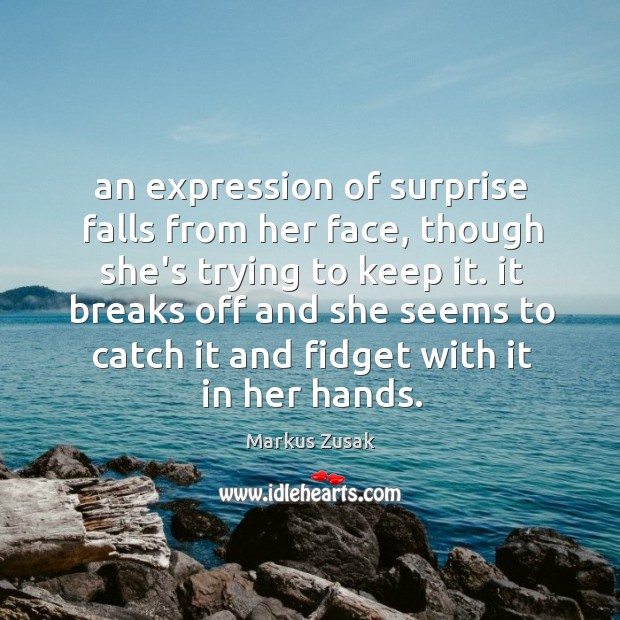 An expression of surprise falls from her face, though she’s trying to Image