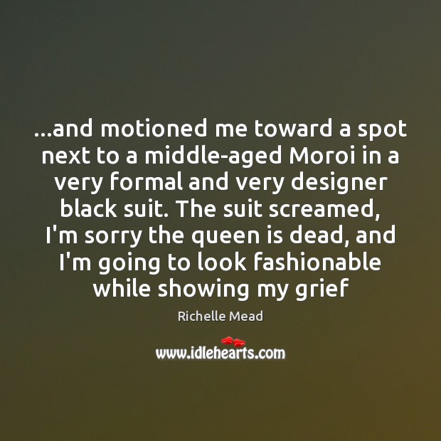…and motioned me toward a spot next to a middle-aged Moroi in Image