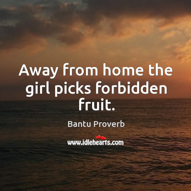 Away from home the girl picks forbidden fruit. Image