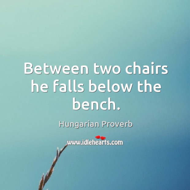 Between two chairs he falls below the bench. Image