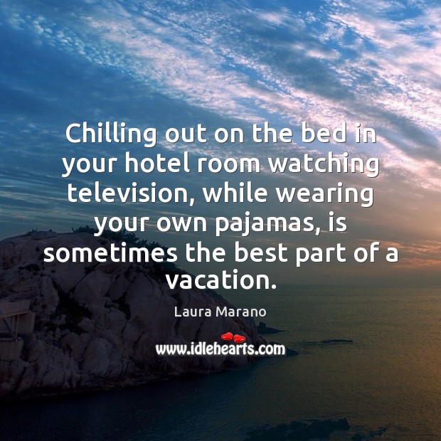 Chilling out on the bed in your hotel room watching television, while Image