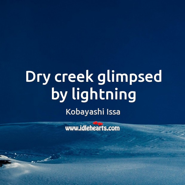 Dry creek glimpsed by lightning Image