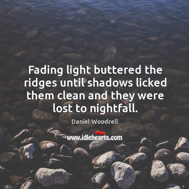 Fading light buttered the ridges until shadows licked them clean and they Daniel Woodrell Picture Quote