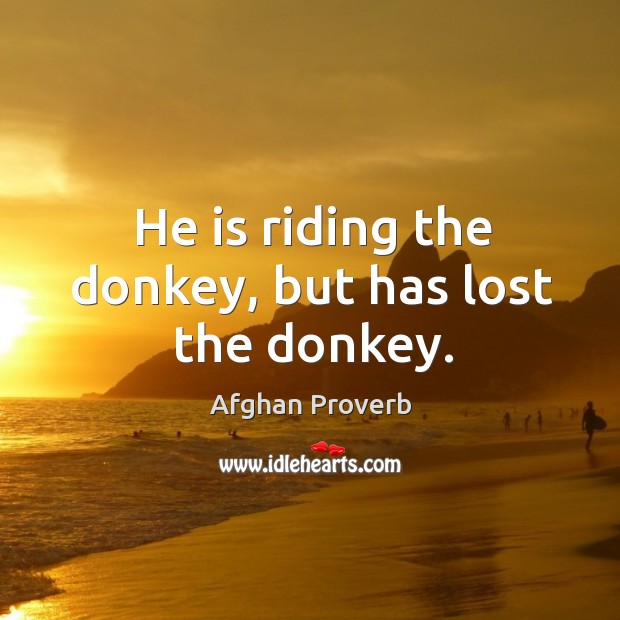 He is riding the donkey, but has lost the donkey. Image