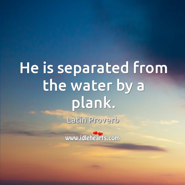 He is separated from the water by a plank. Image