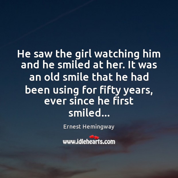 He saw the girl watching him and he smiled at her. It Image