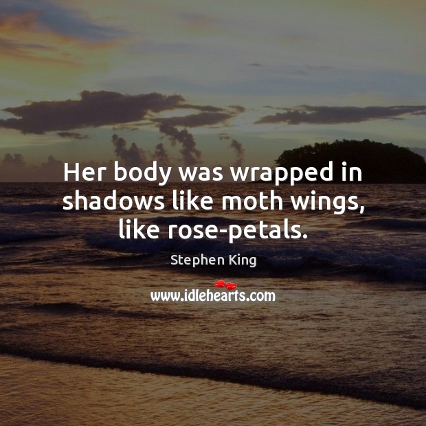 Her body was wrapped in shadows like moth wings, like rose-petals. Image