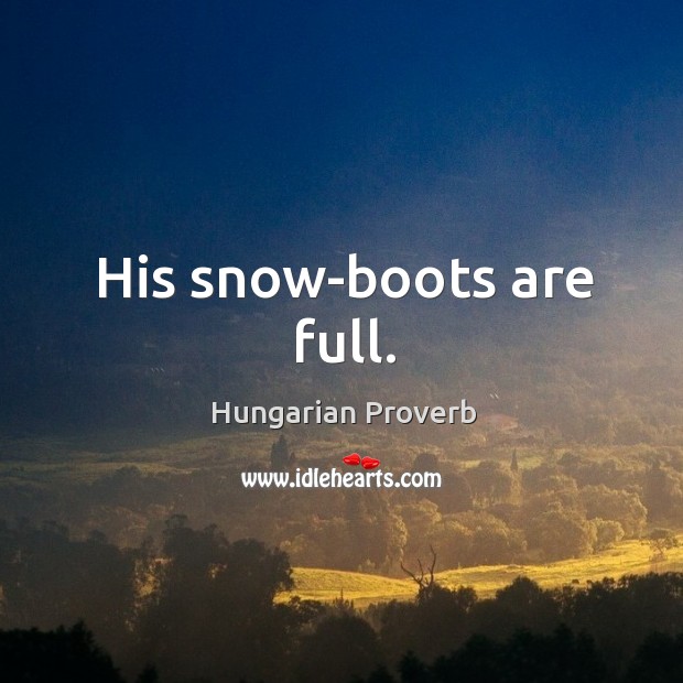 His snow-boots are full. Image