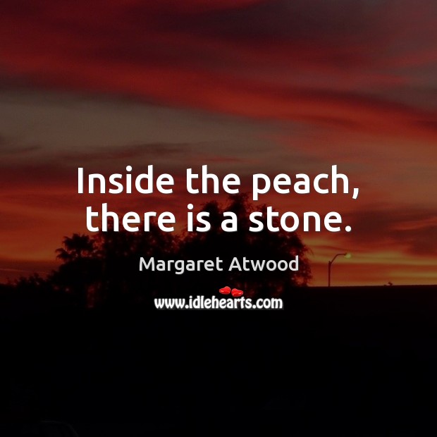 Inside the peach, there is a stone. Image