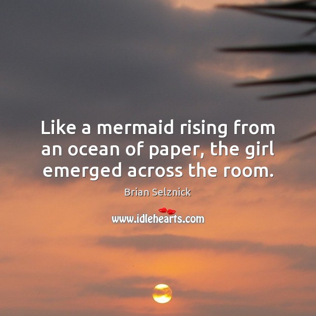 Like a mermaid rising from an ocean of paper, the girl emerged across the room. Image