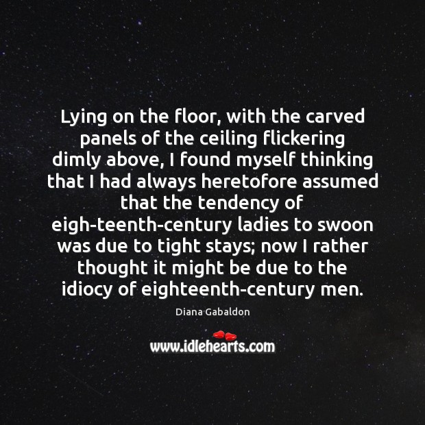 Lying on the floor, with the carved panels of the ceiling flickering Image