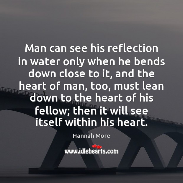 Man can see his reflection in water only when he bends down Image