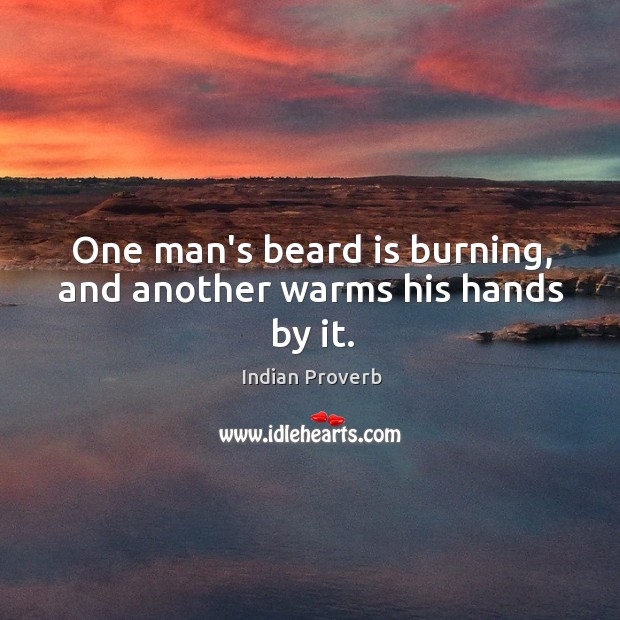 One man’s beard is burning, and another warms his hands by it. Image