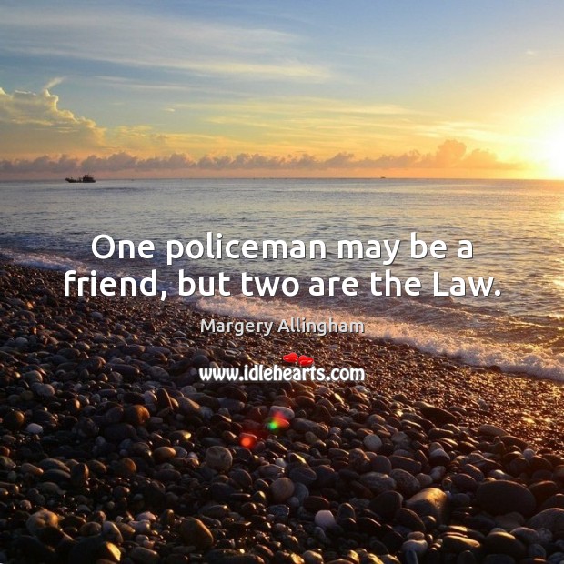 One policeman may be a friend, but two are the Law. Image