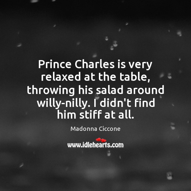 Prince Charles is very relaxed at the table, throwing his salad around Image