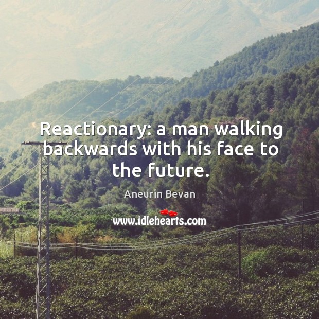 Reactionary: a man walking backwards with his face to the future. Image