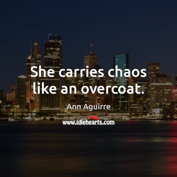 She carries chaos like an overcoat. Image
