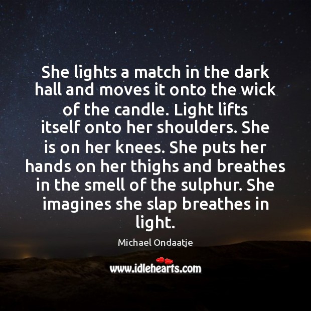 She lights a match in the dark hall and moves it onto Image