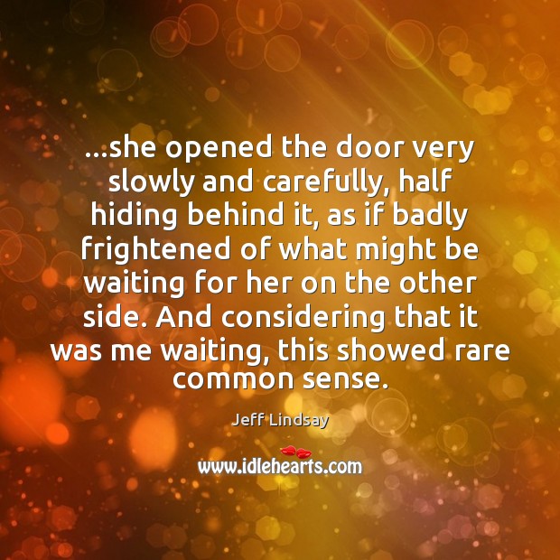 …she opened the door very slowly and carefully, half hiding behind it, Image