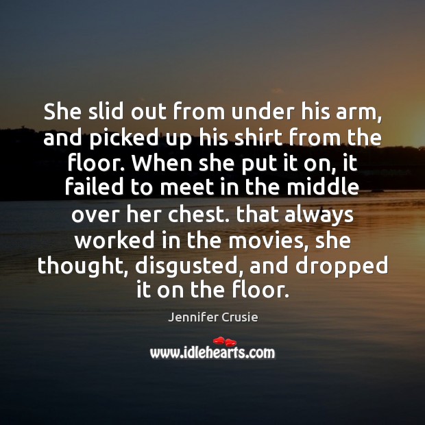 She slid out from under his arm, and picked up his shirt Image