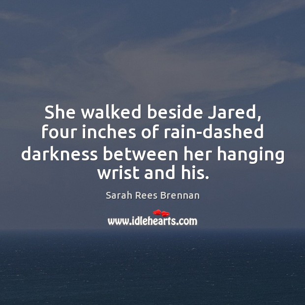 She walked beside Jared, four inches of rain-dashed darkness between her hanging Image