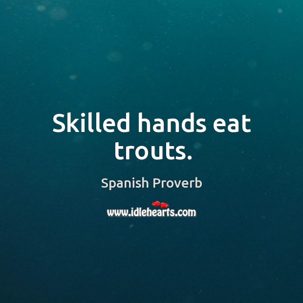 Skilled hands eat trouts. Image