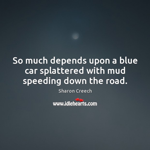 So much depends upon a blue car splattered with mud speeding down the road. Image