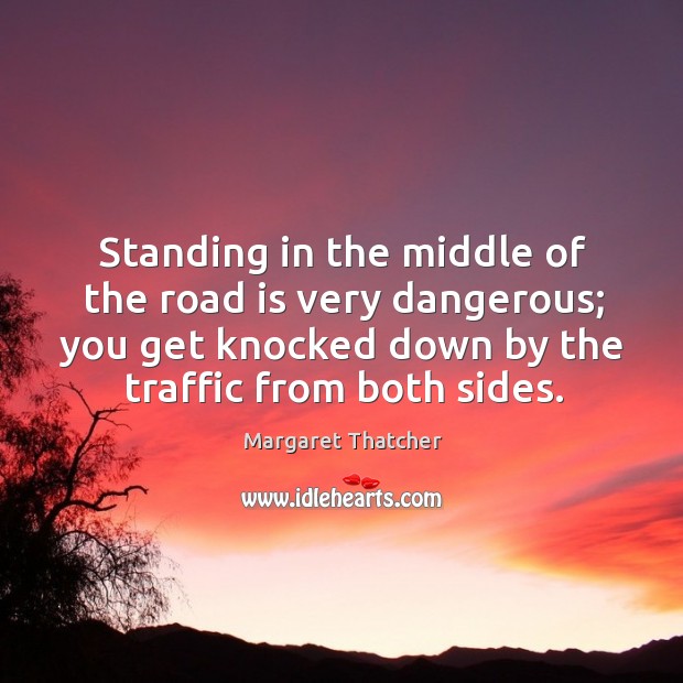 Standing in the middle of the road is very dangerous; you get knocked down by the traffic from both sides. Image