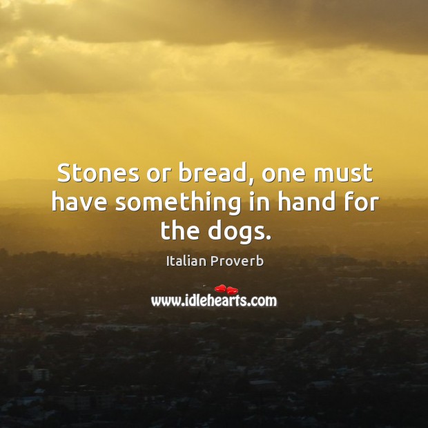 Stones or bread, one must have something in hand for the dogs. Image