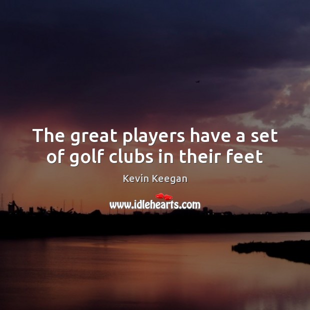 The great players have a set of golf clubs in their feet Image