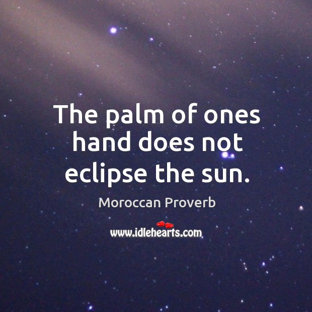 The palm of ones hand does not eclipse the sun. Image