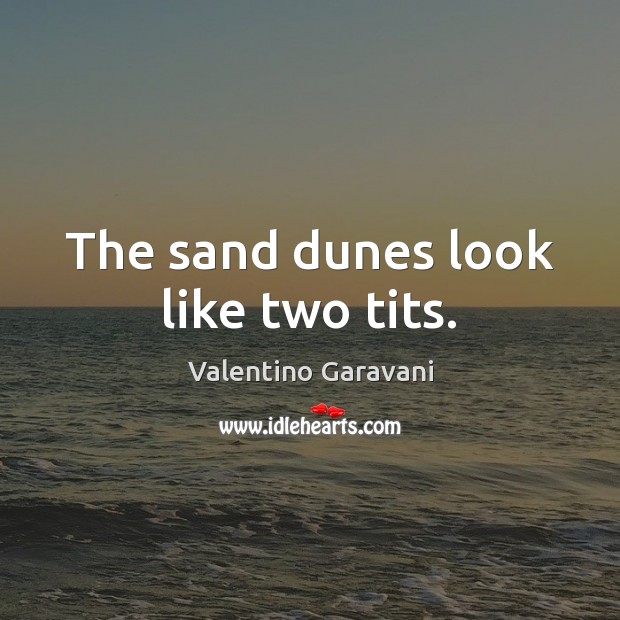 The sand dunes look like two tits. Image