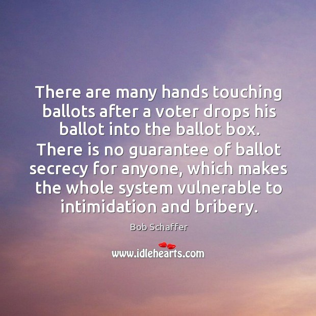 There are many hands touching ballots after a voter drops his ballot into the ballot box. Image