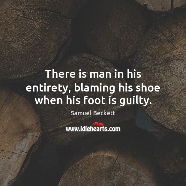 There is man in his entirety, blaming his shoe when his foot is guilty. Image