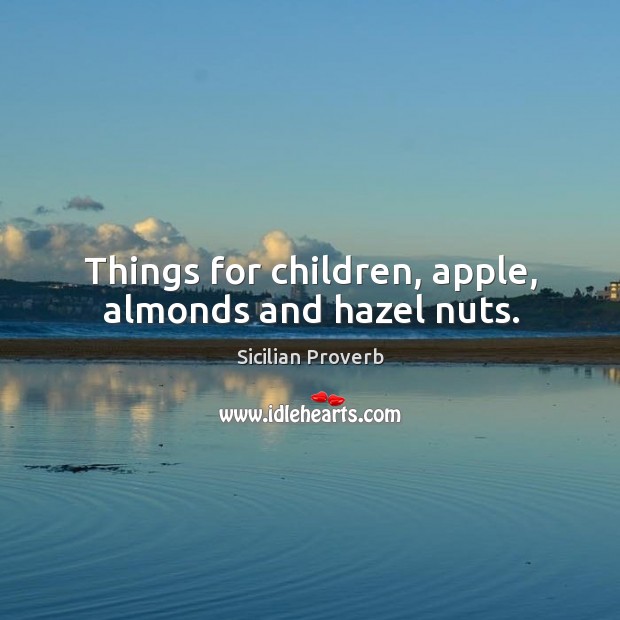 Things for children, apple, almonds and hazel nuts. Image