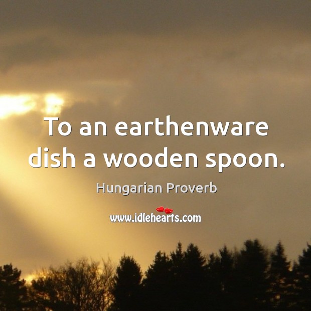 To an earthenware dish a wooden spoon. Image