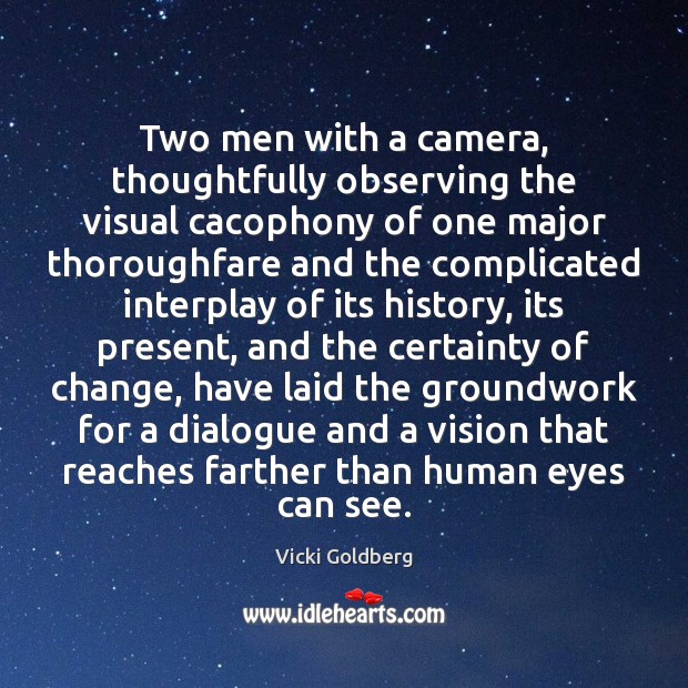 Two men with a camera, thoughtfully observing the visual cacophony of one Image