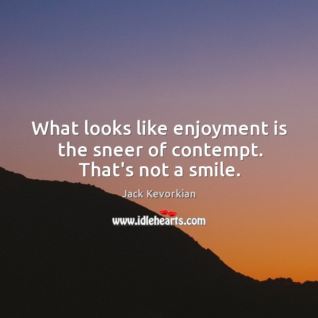 What looks like enjoyment is the sneer of contempt. That’s not a smile. Image