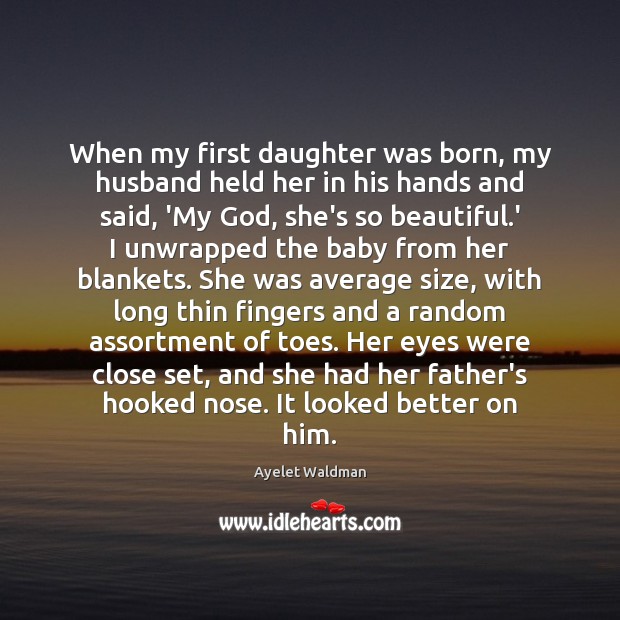 When my first daughter was born, my husband held her in his Image