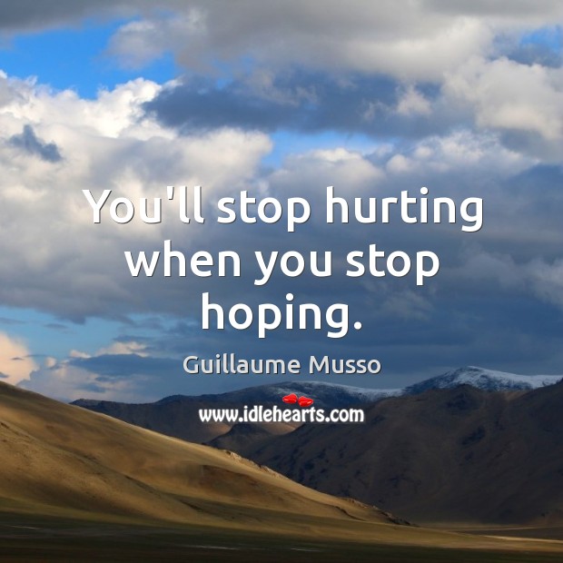 You’ll stop hurting when you stop hoping. Guillaume Musso Picture Quote